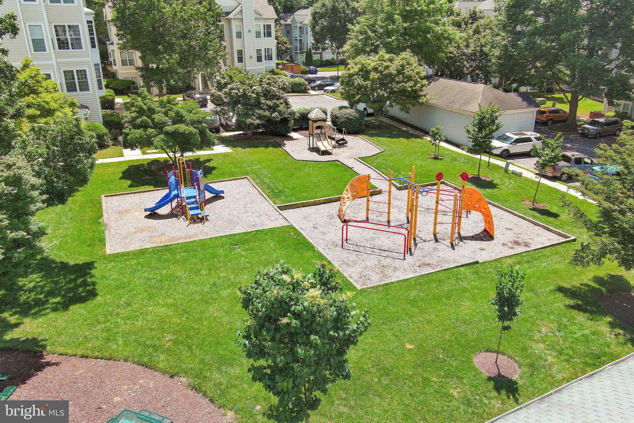 18521 Boysenberry Drive, Unit 242172 Gaithersburg, MD 20879 - Photo 31 of 43 an aerial view of a house with outdoor space pool seating area and yard