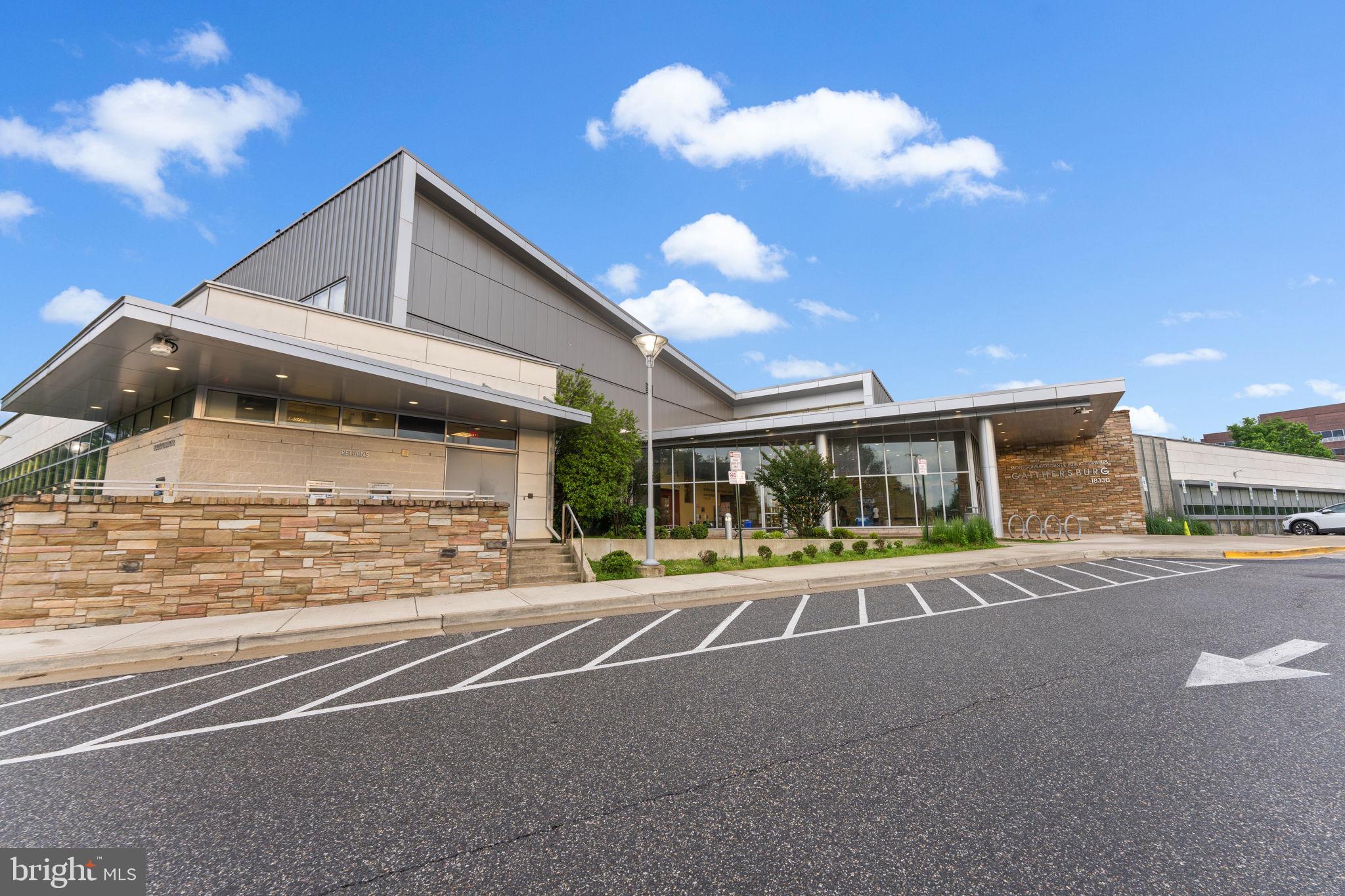 18521 Boysenberry Drive, Unit 242172 Gaithersburg, MD 20879 - Photo 33 of 43 a view of a house with a yard