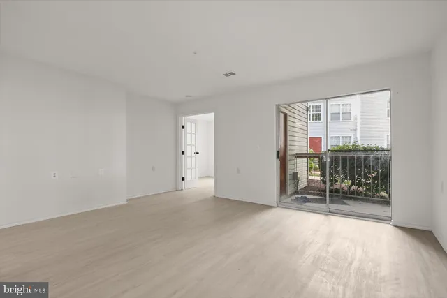 a view of a kitchen with wooden floor