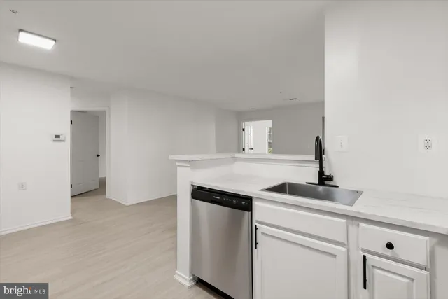 a view of cabinets and refrigerator