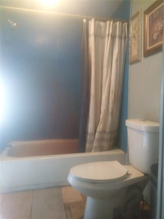 17321 Caudel Road Orlando, FL 32833 - Photo 4 of 14 a white toilet sitting next to a bath tub