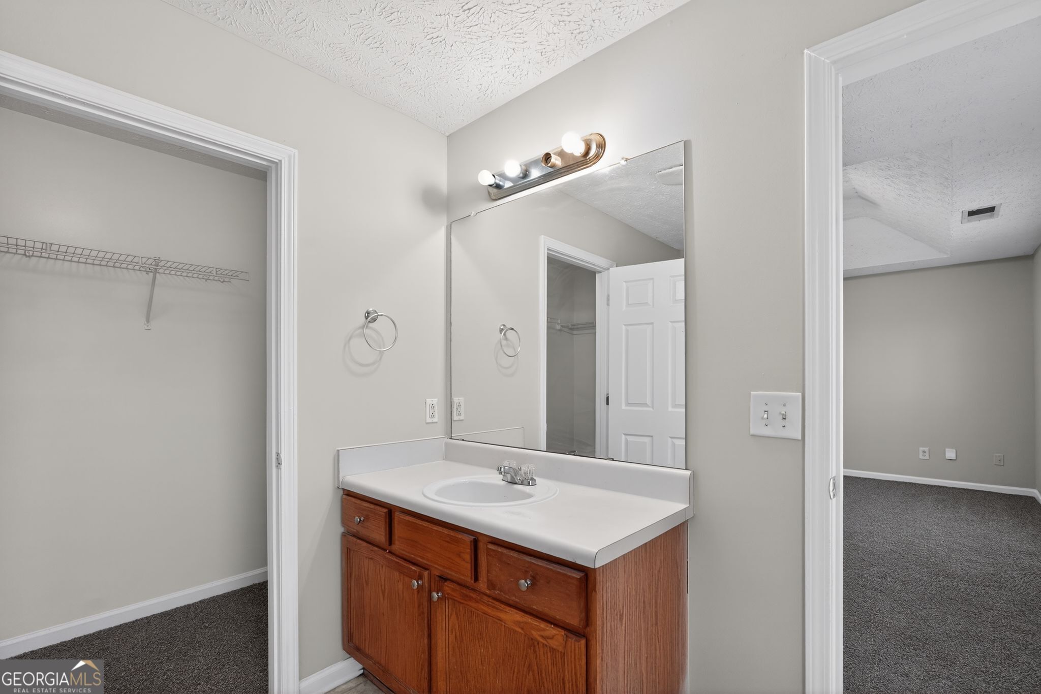 3969 Cress Way Run Decatur, GA 30034 - Photo 29 of 34 a bathroom with a sink a mirror and a shower