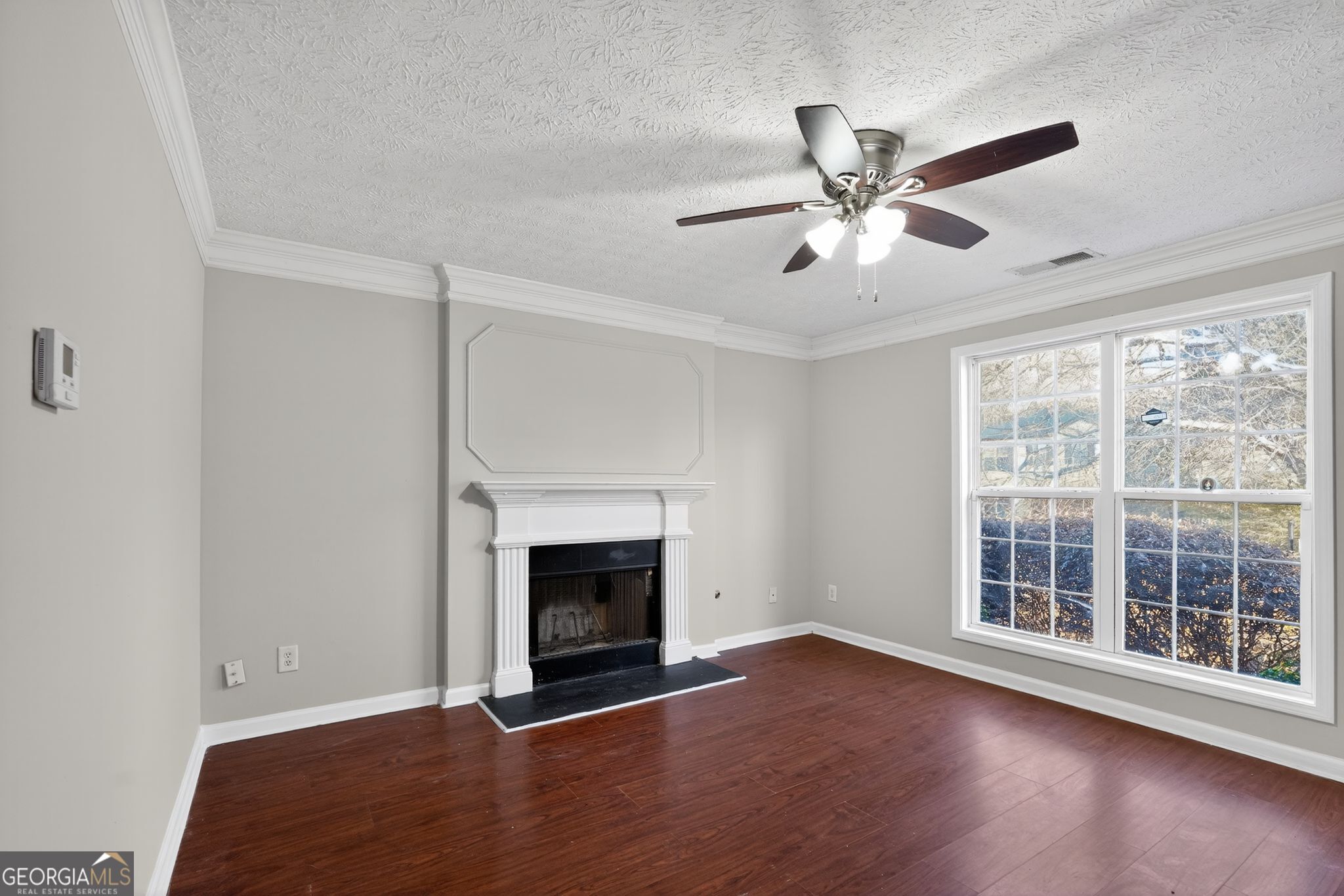 3969 Cress Way Run Decatur, GA 30034 - Photo 7 of 34 a view of an empty room with wooden floor and a window