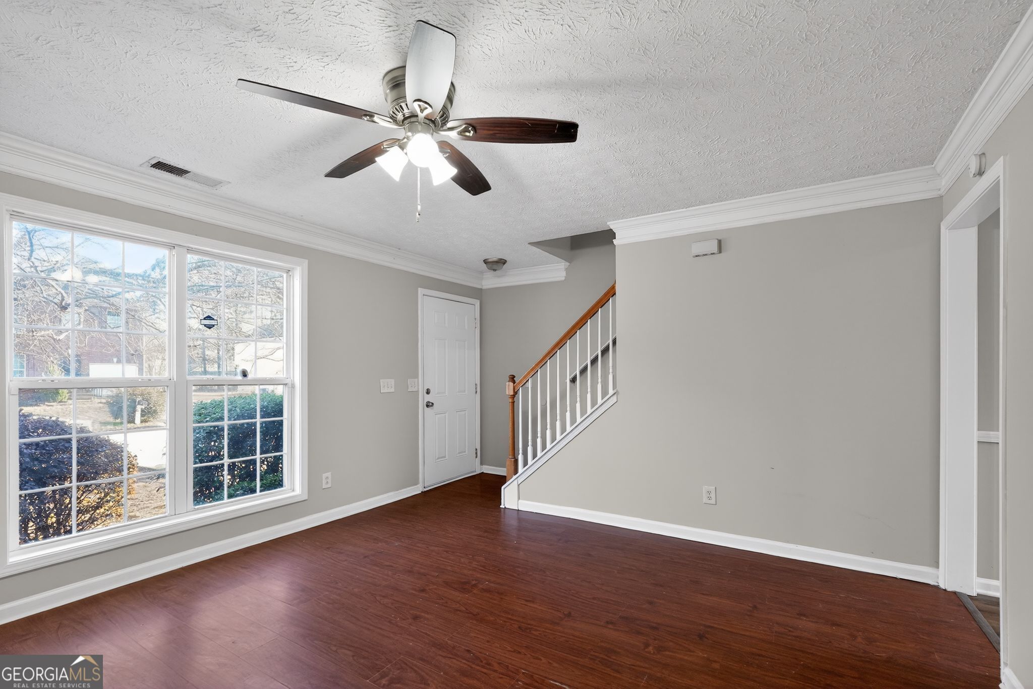 3969 Cress Way Run Decatur, GA 30034 - Photo 9 of 34 a view of an empty room with wooden floor and a window