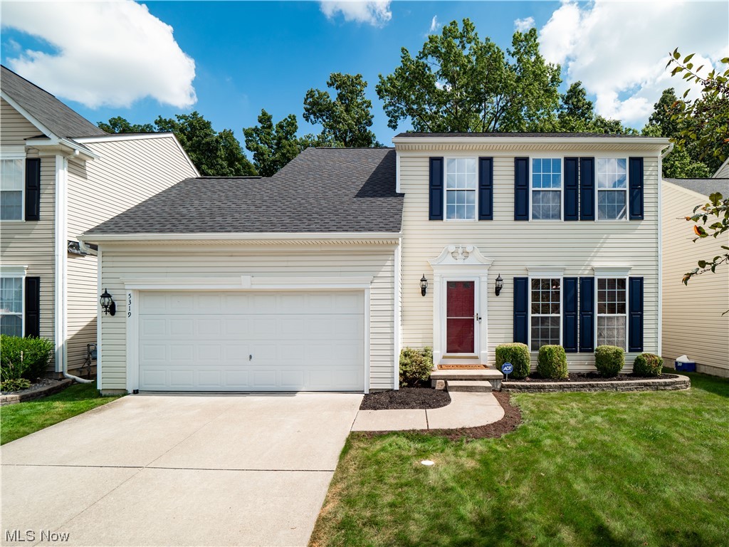5319 Otten Road North Ridgeville, OH 44039 - Photo 1 of 33 Colonial-style house featuring a front yard and garage