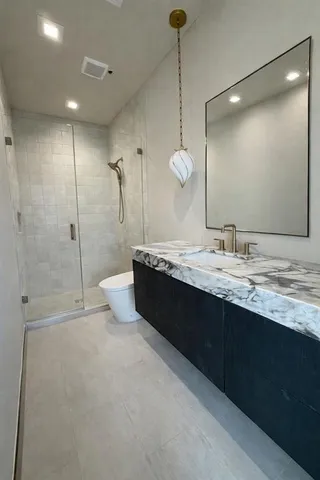 a living room with furniture a window and a potted plant