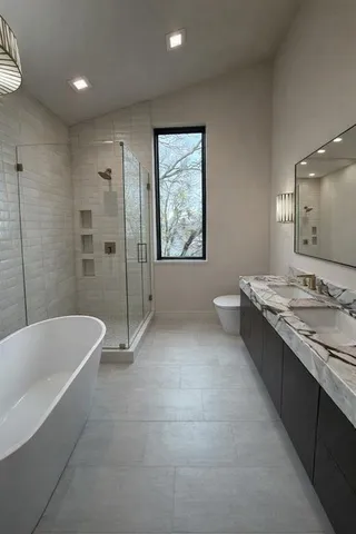 a room with pool table and windows