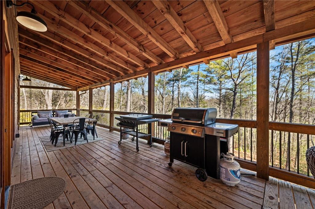 155 Peppermint Lane Epworth, GA 30541 - Photo 18 of 61 a view of a chairs and table in patio with wooden floor
