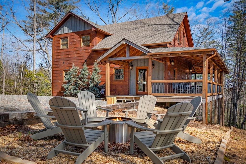 155 Peppermint Lane Epworth, GA 30541 - Photo 2 of 61 a view of house with outdoor seating space