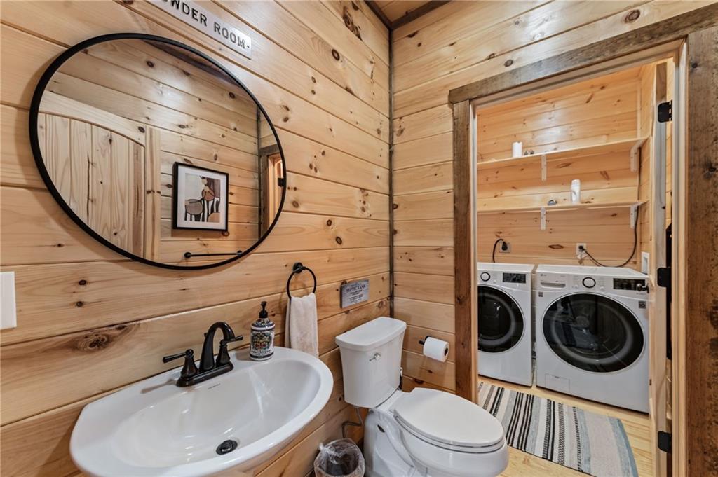 155 Peppermint Lane Epworth, GA 30541 - Photo 21 of 61 a bathroom with a sink a mirror a toilet and a mirror