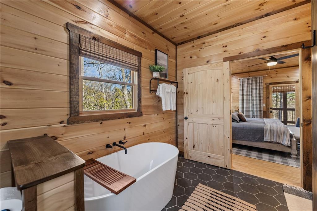 155 Peppermint Lane Epworth, GA 30541 - Photo 27 of 61 a bathroom with a sink and a bathtub