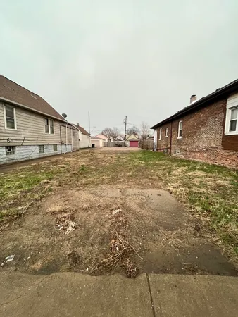 a view of a yard with an outdoor space