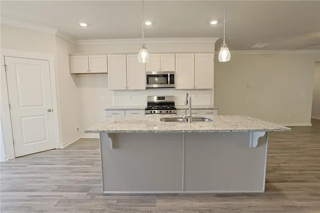 a view of kitchen with wooden floor and window