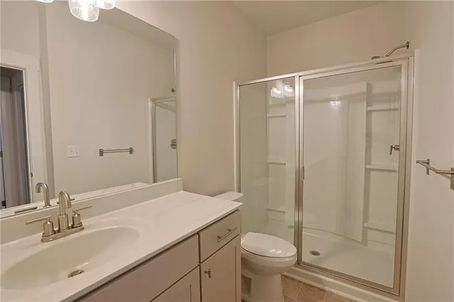 a view of a livingroom with a ceiling fan and window