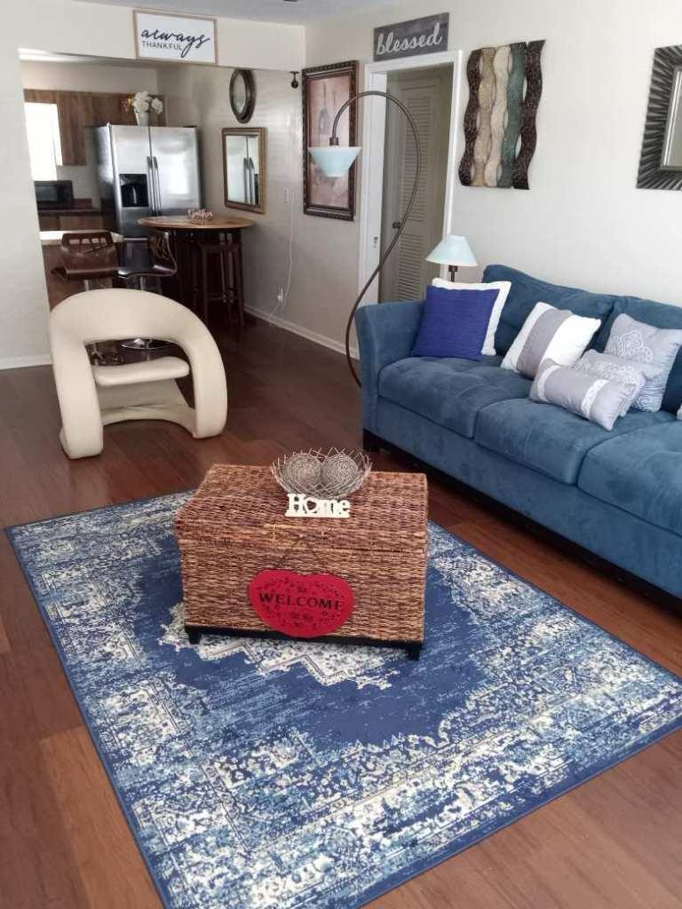 731 21st Street, Unit 12 West Palm Beach, FL 33407 - Photo 3 of 4 a living room with furniture and a couch