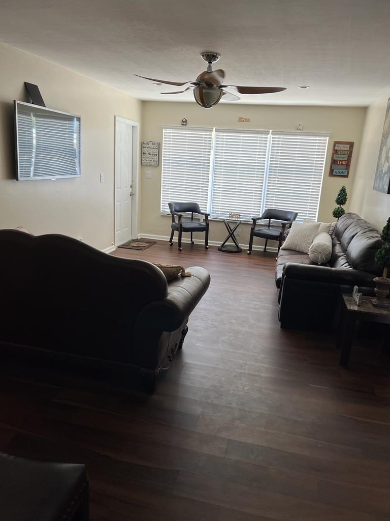 731 21st Street, Unit 12 West Palm Beach, FL 33407 - Photo 4 of 4 a living room with furniture and a large window