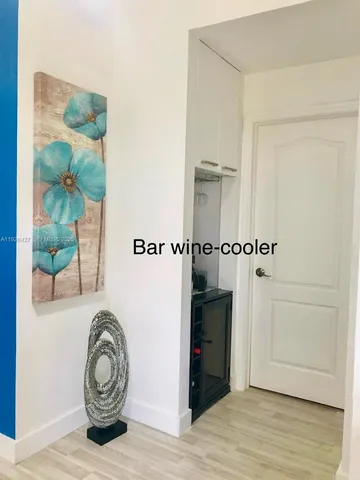 a view of a storage & utility room with wooden floor