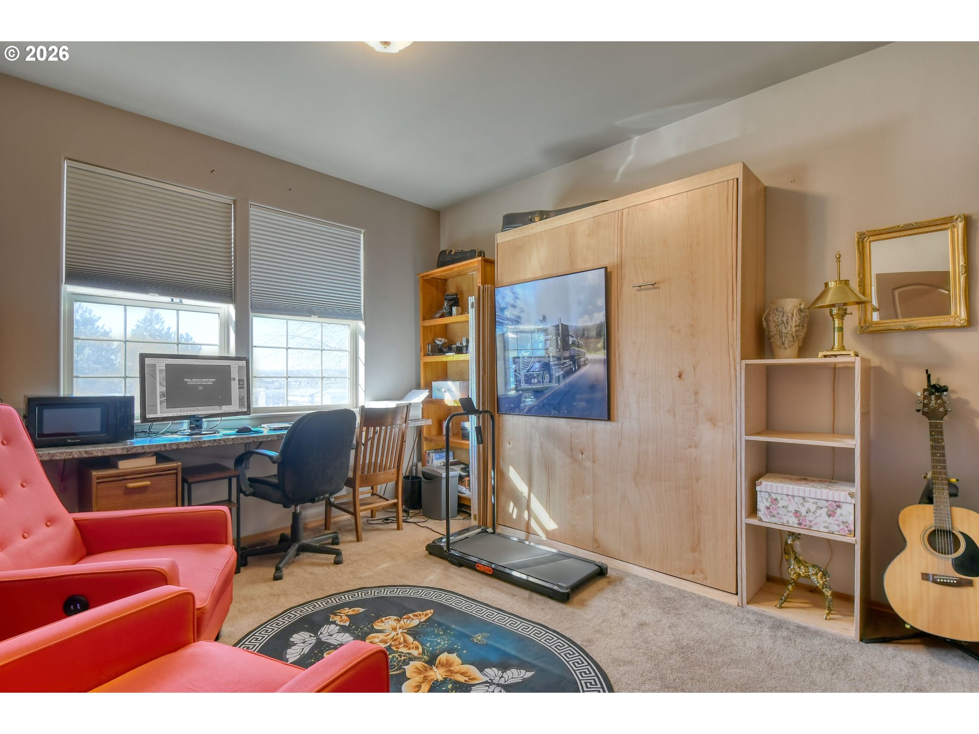 2175 Northwest Gilliam Avenue Pendleton, OR 97801 - Photo 20 of 36 a living room with furniture and a floor to ceiling window
