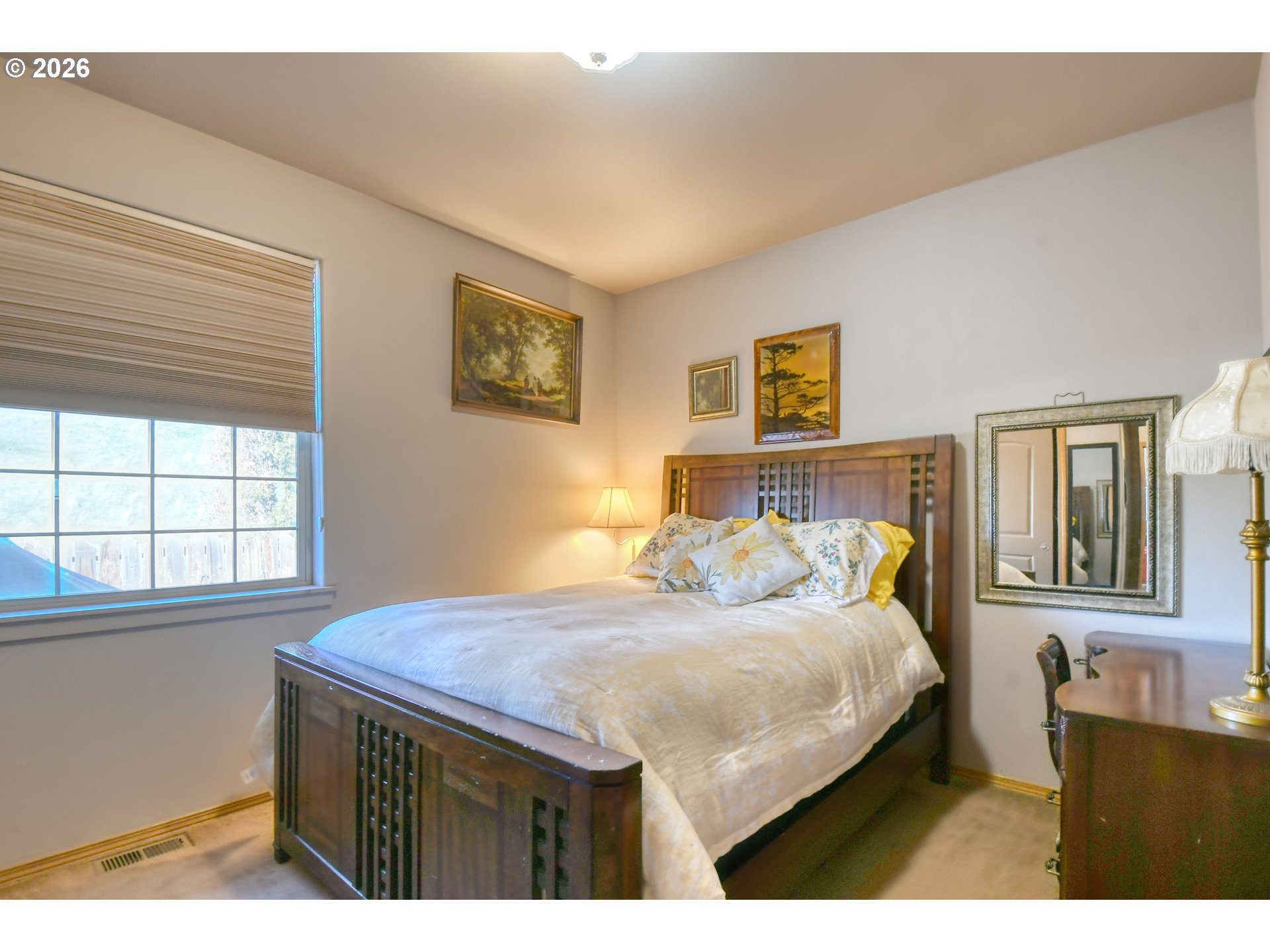2175 Northwest Gilliam Avenue Pendleton, OR 97801 - Photo 23 of 36 a bedroom with a bed and a window