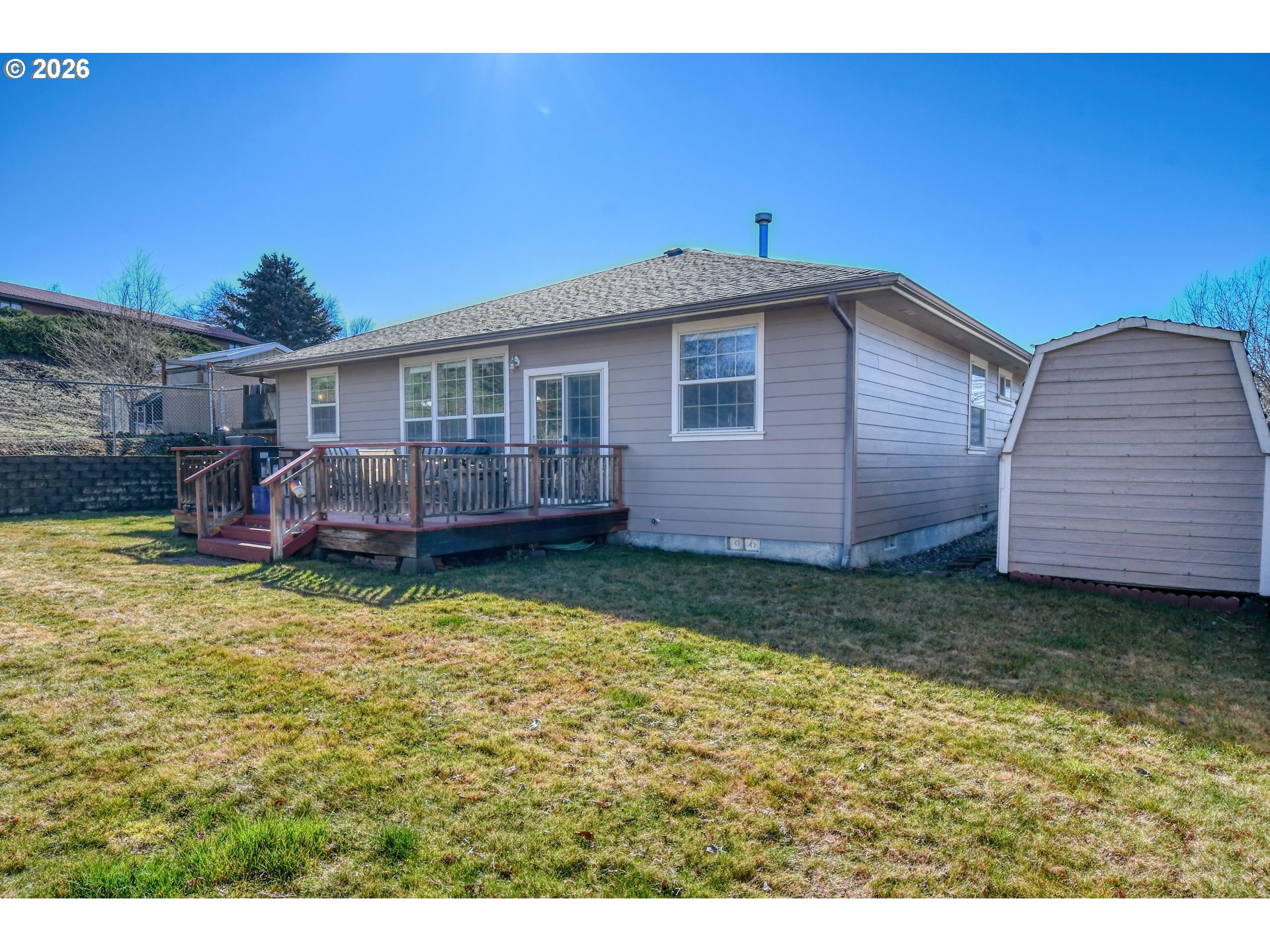2175 Northwest Gilliam Avenue Pendleton, OR 97801 - Photo 34 of 36 a backyard of a house with barbeque oven table and chairs