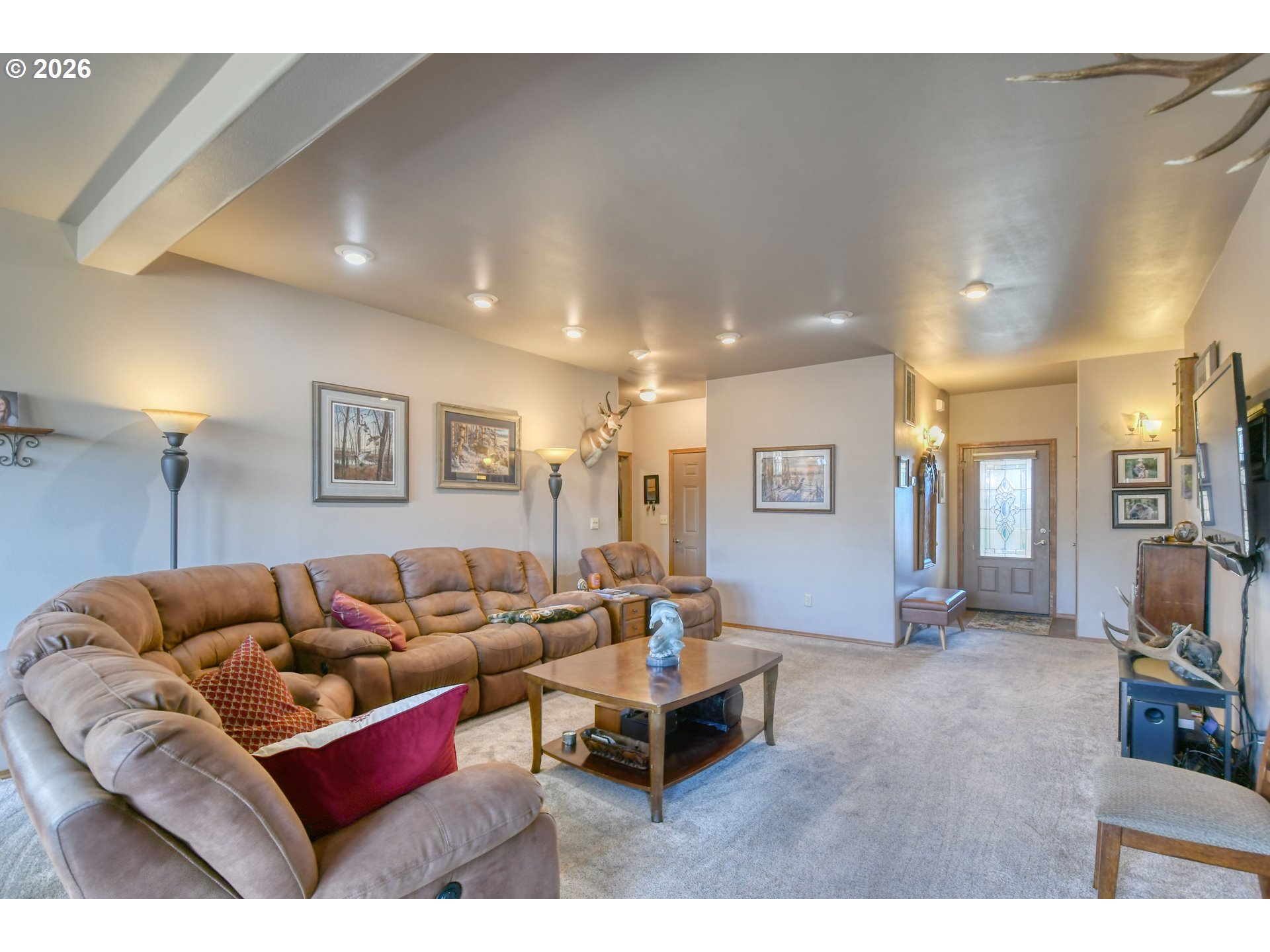 2175 Northwest Gilliam Avenue Pendleton, OR 97801 - Photo 4 of 36 a living room with furniture a flat screen tv and a table