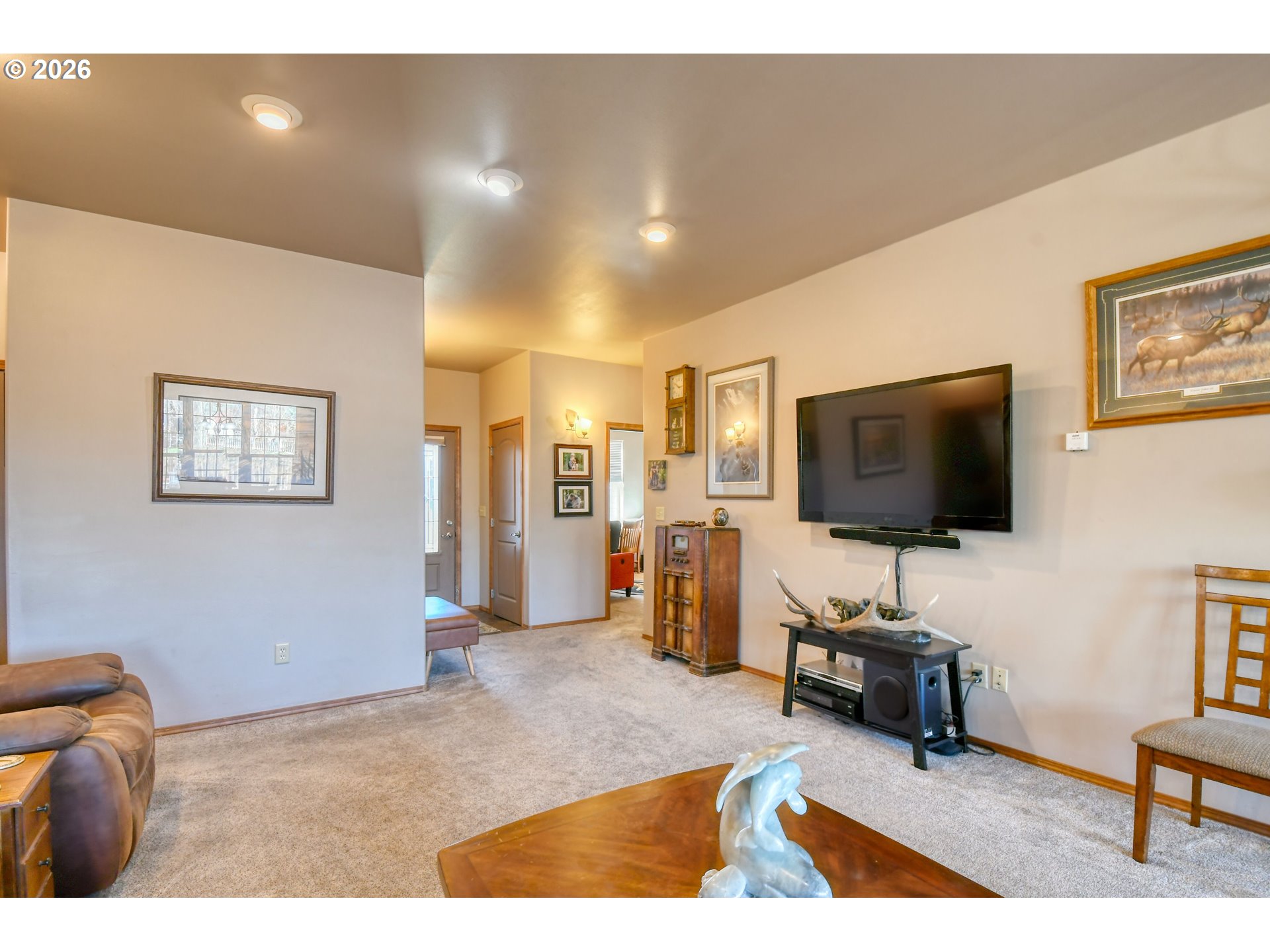 2175 Northwest Gilliam Avenue Pendleton, OR 97801 - Photo 8 of 36 a living room with furniture and a flat screen tv