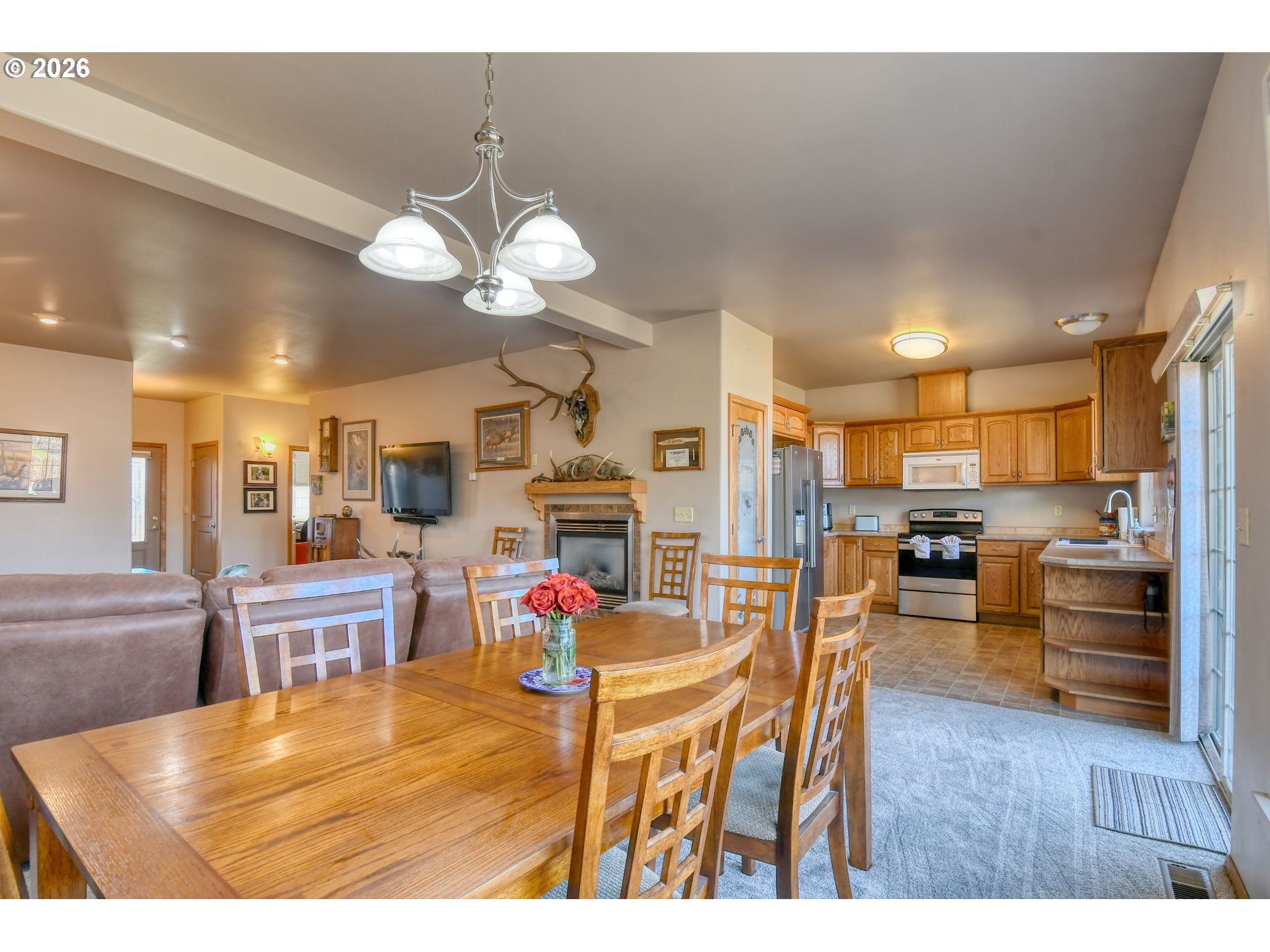 2175 Northwest Gilliam Avenue Pendleton, OR 97801 - Photo 9 of 36 a living room with kitchen furniture and a kitchen view
