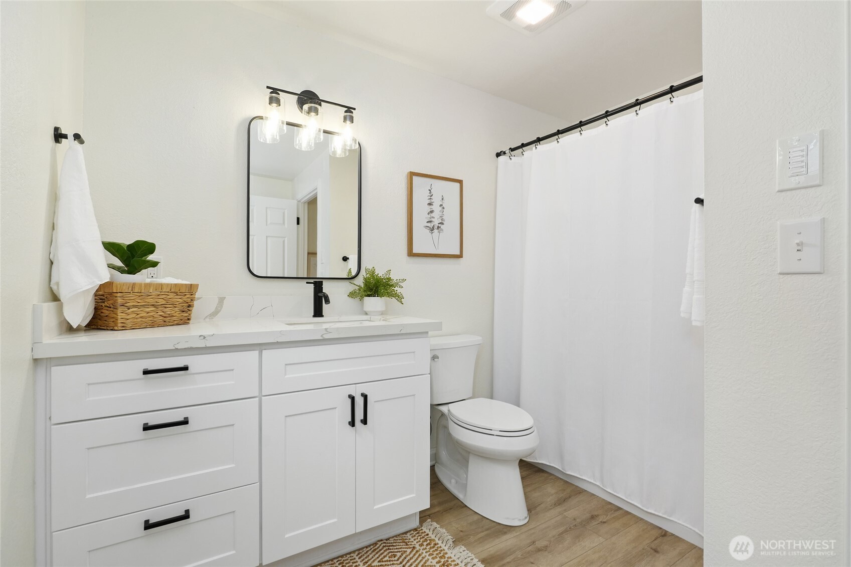 19922 3rd Drive Southeast Bothell, WA 98012 - Photo 11 of 30 a bathroom with a toilet sink and mirror