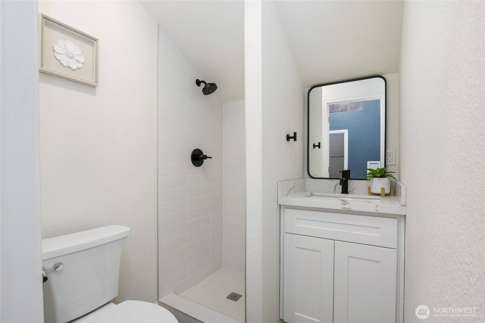 19922 3rd Drive Southeast Bothell, WA 98012 - Photo 25 of 30 a bathroom with a granite countertop sink a mirror a toilet and shower