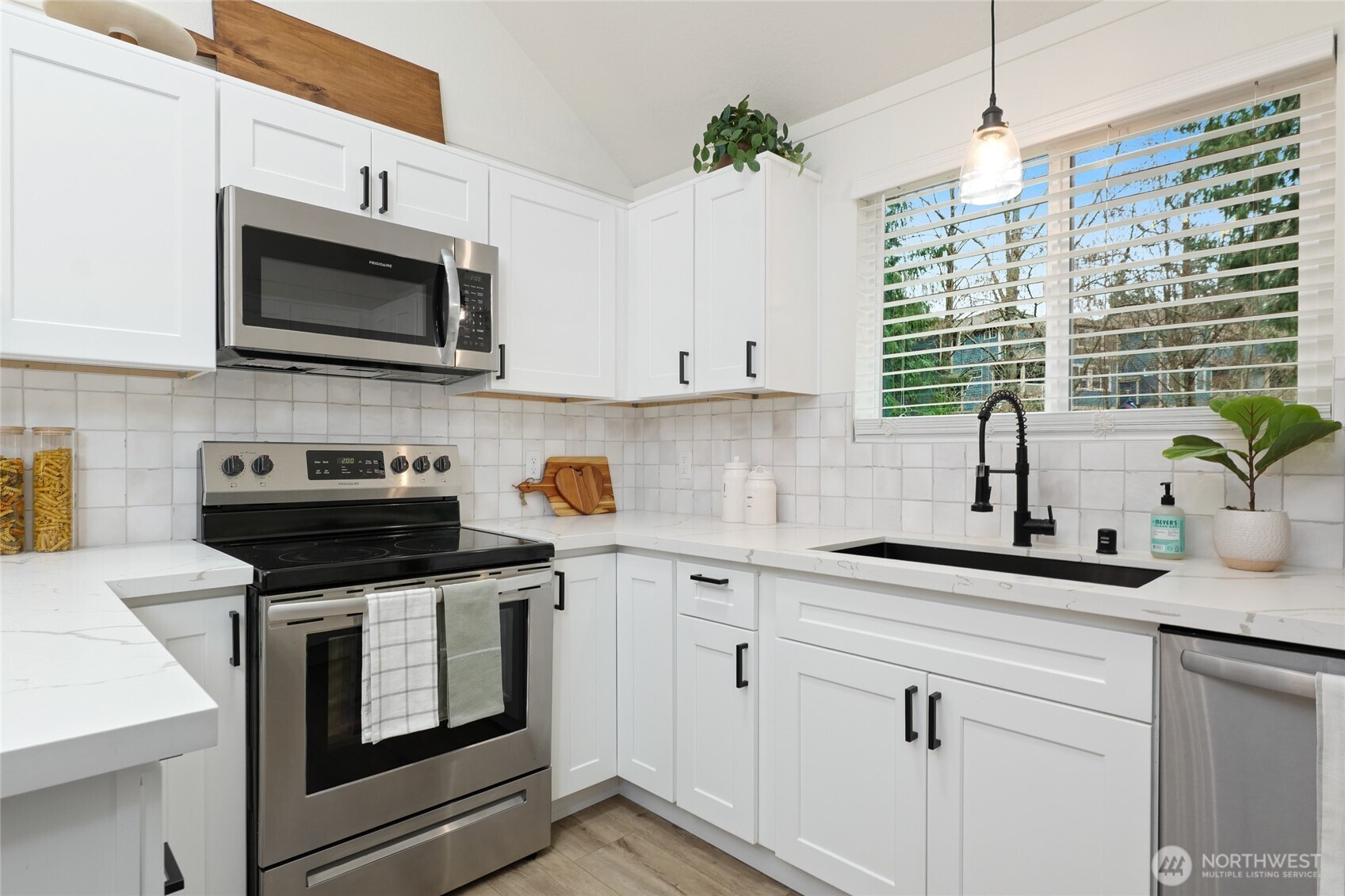 19922 3rd Drive Southeast Bothell, WA 98012 - Photo 9 of 30 a kitchen with stainless steel appliances white cabinets and a stove