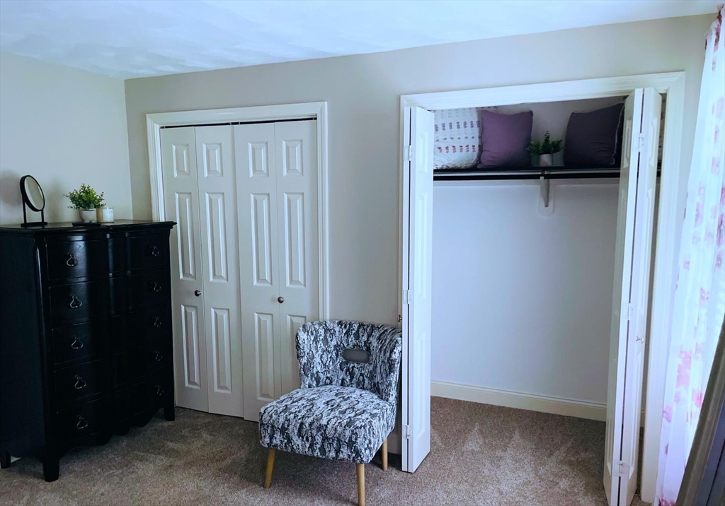 170 South Worcester Street, Unit 3 Norton, MA 02766 - Photo 12 of 17 a living room with furniture and a closet