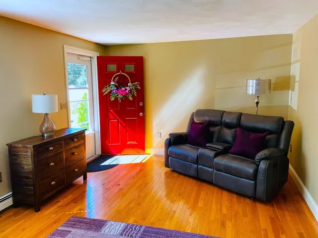 a living room with furniture fireplace and lamp