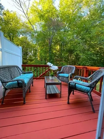 a roof deck with a table and chairs