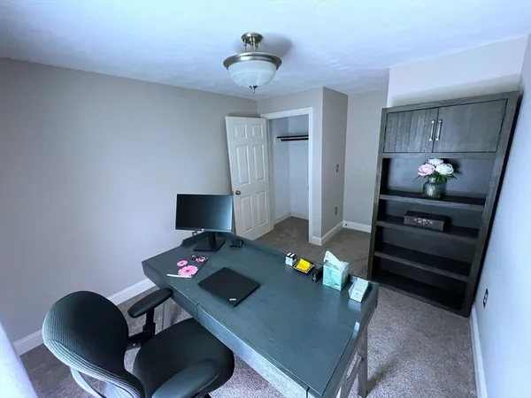 a work room with furniture and wooden floor
