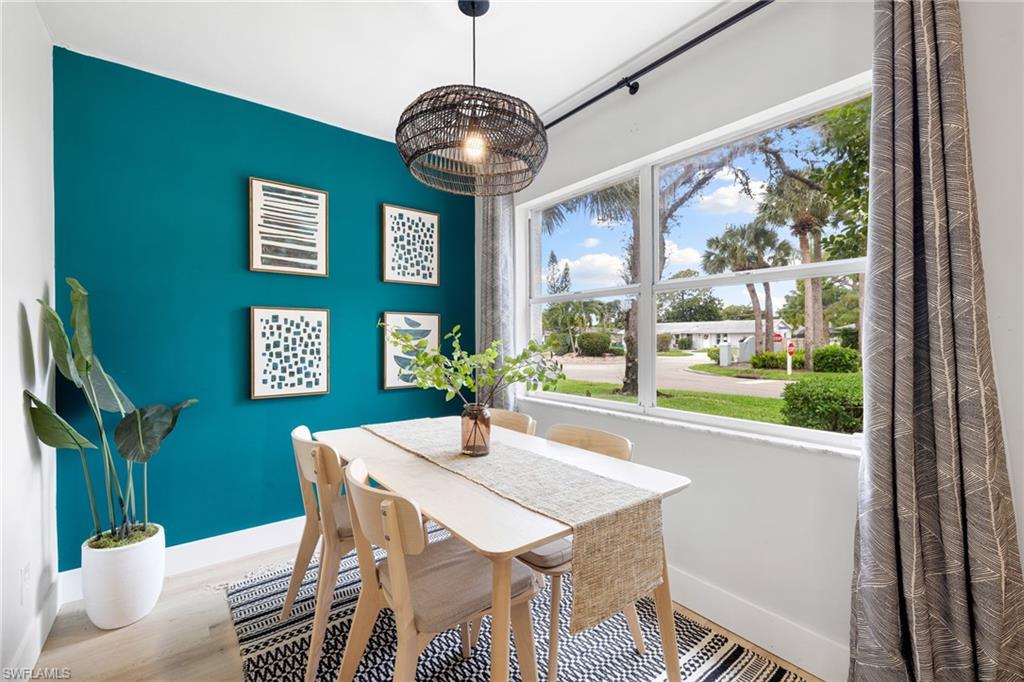 a view of a dining room with furniture window and outside view