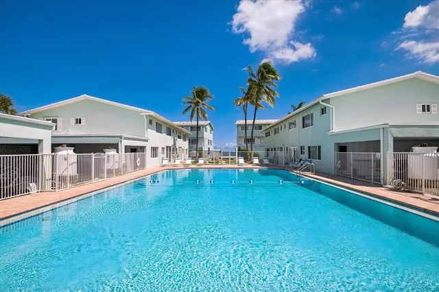 a front view of a house with swimming pool