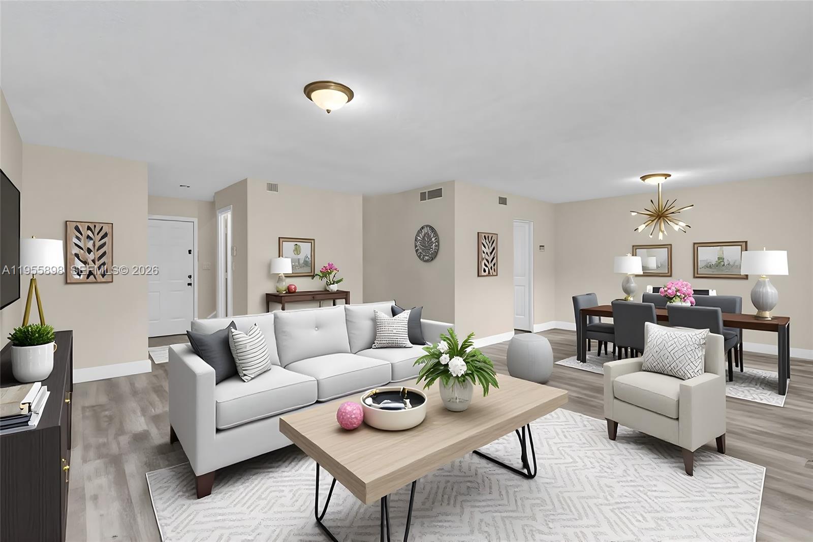 17901 Northwest 68th Avenue, Unit T206 Hialeah, FL 33015 - Photo 1 of 27 a living room with furniture and a table