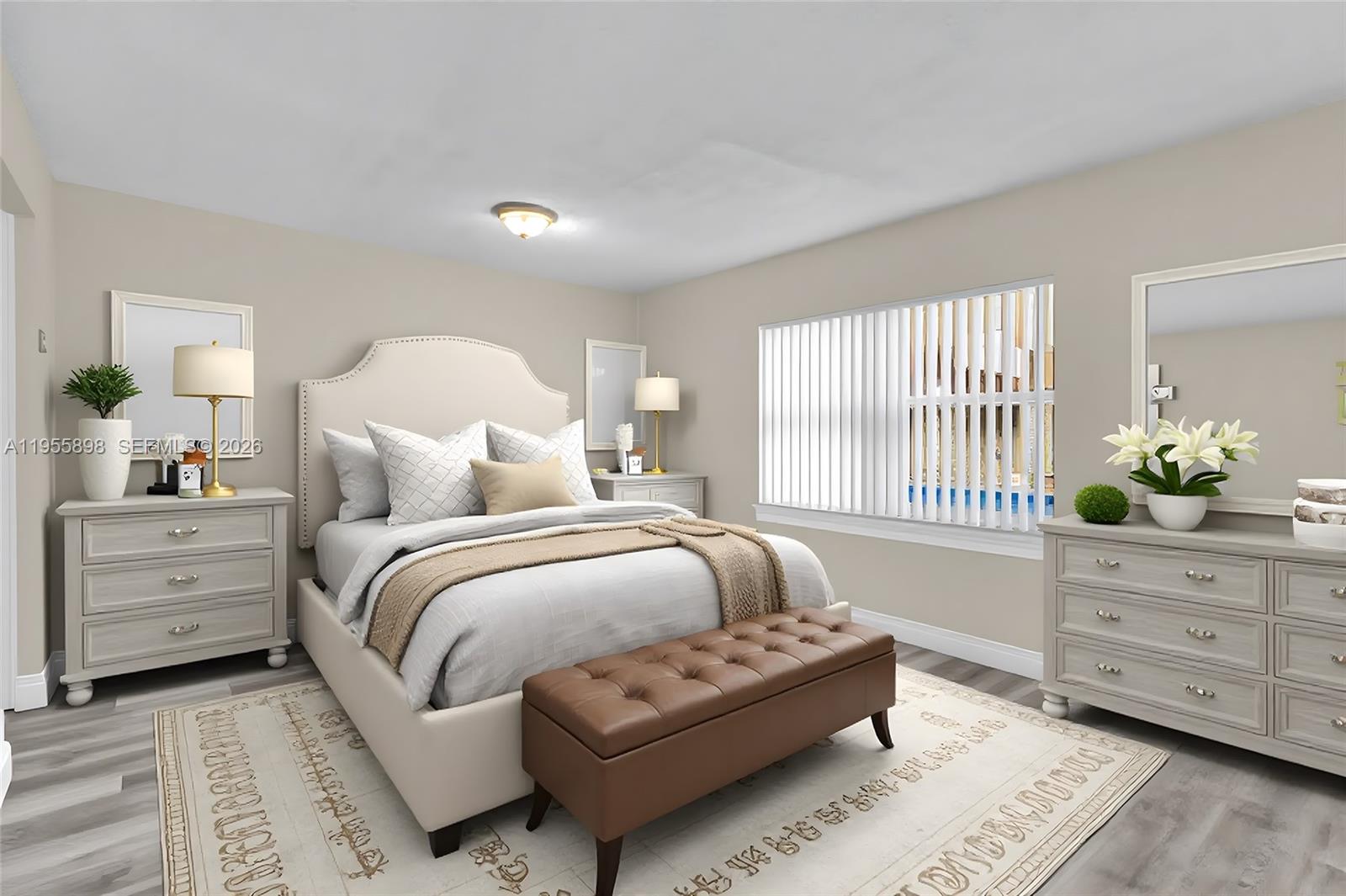 17901 Northwest 68th Avenue, Unit T206 Hialeah, FL 33015 - Photo 12 of 27 a bedroom with a bed and window