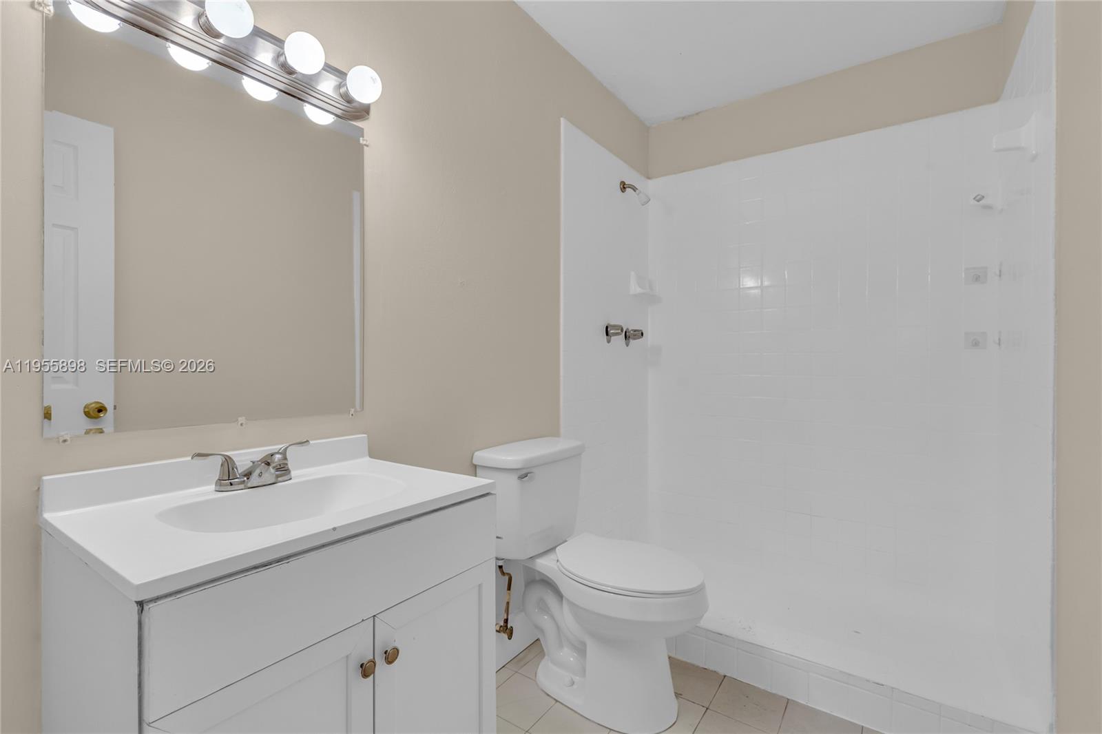 17901 Northwest 68th Avenue, Unit T206 Hialeah, FL 33015 - Photo 14 of 27 a bathroom with a sink toilet and vanity