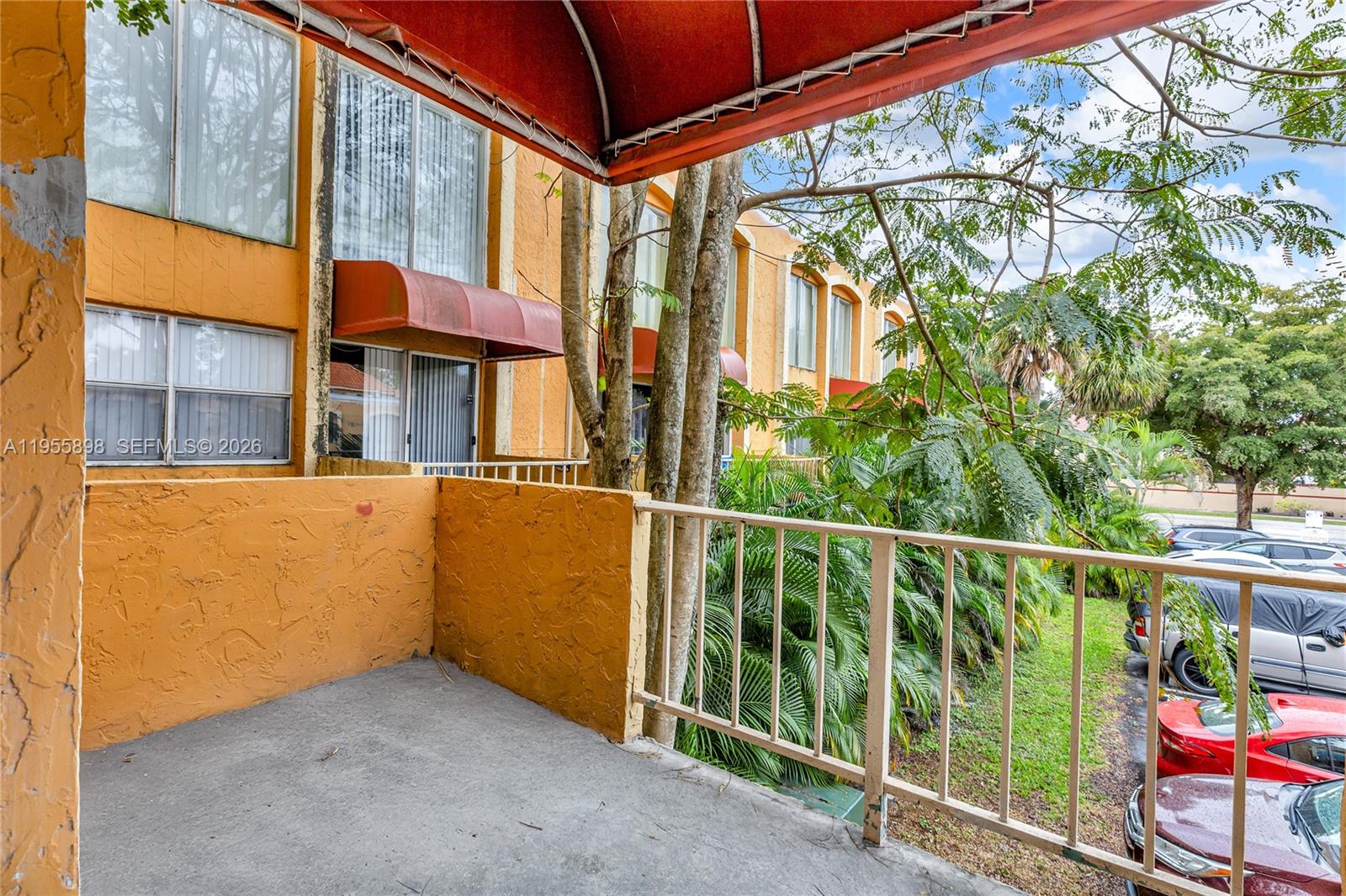 17901 Northwest 68th Avenue, Unit T206 Hialeah, FL 33015 - Photo 20 of 27 a view of a building from a balcony
