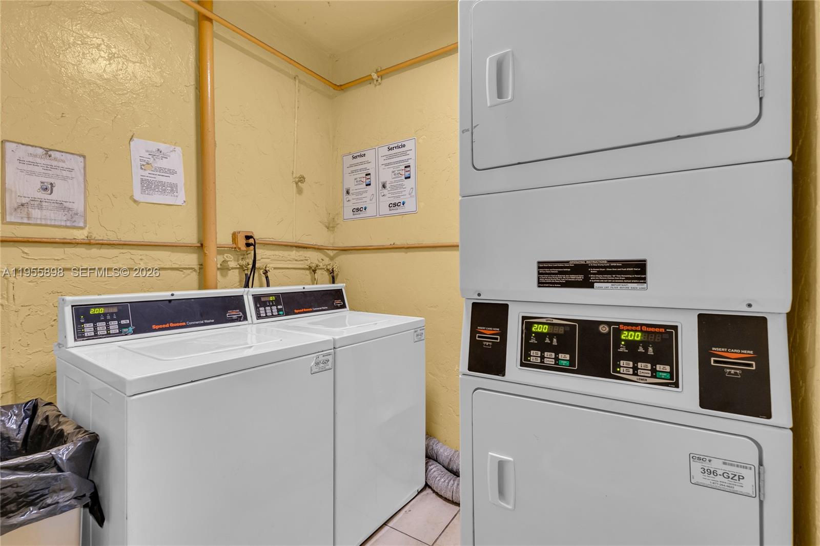 17901 Northwest 68th Avenue, Unit T206 Hialeah, FL 33015 - Photo 23 of 27 a utility room with dryer and washer