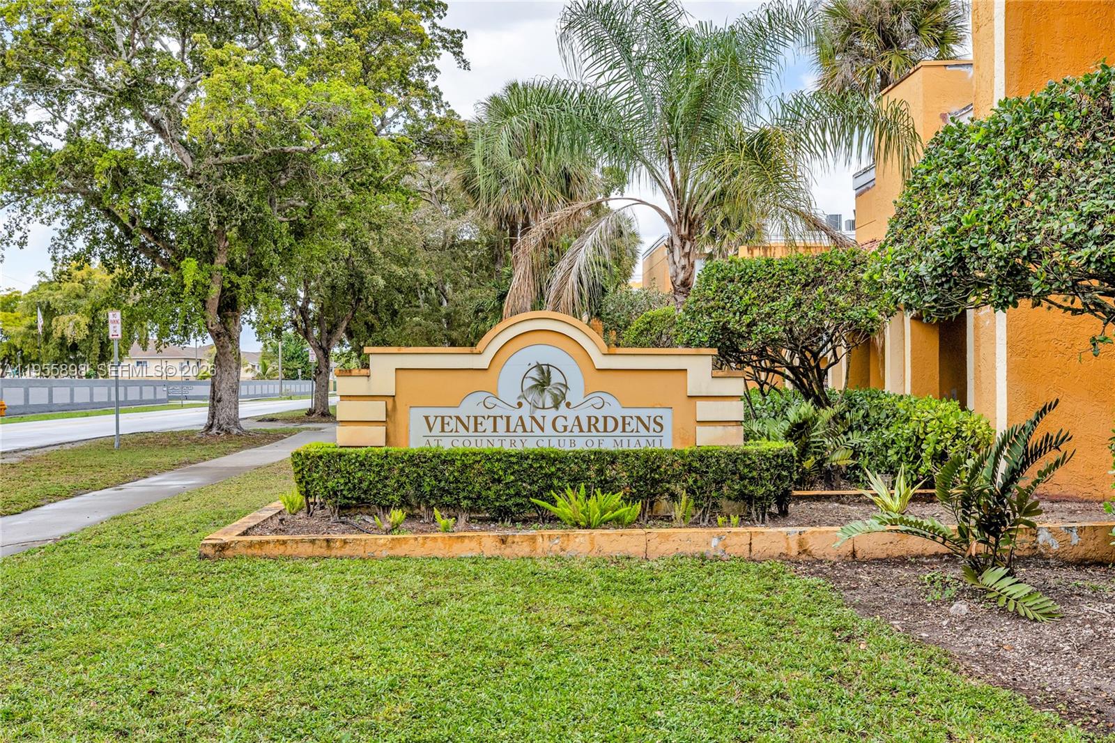 17901 Northwest 68th Avenue, Unit T206 Hialeah, FL 33015 - Photo 24 of 27 a front view of a house with garden