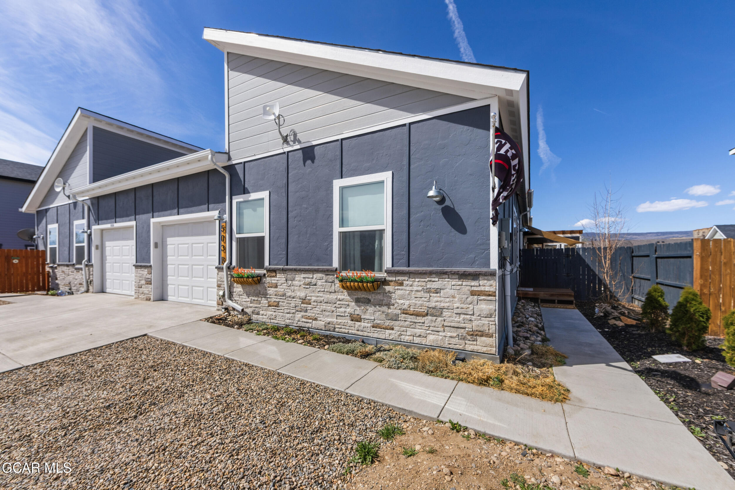 503 12th Street, Unit B Kremmling, CO 80459 - Photo 42 of 44 a front view of a house with a yard