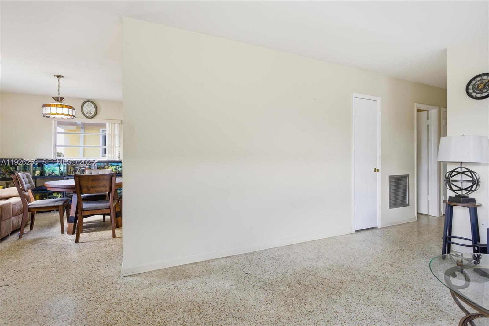 10551 Southwest 27th Street Miami, FL 33165 - Photo 11 of 35 a view of a livingroom with furniture and a window