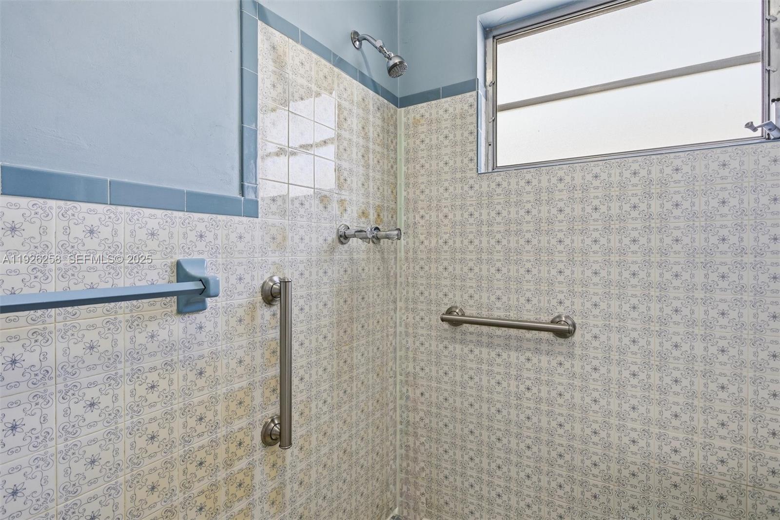 10551 Southwest 27th Street Miami, FL 33165 - Photo 15 of 35 a bathroom with a shower