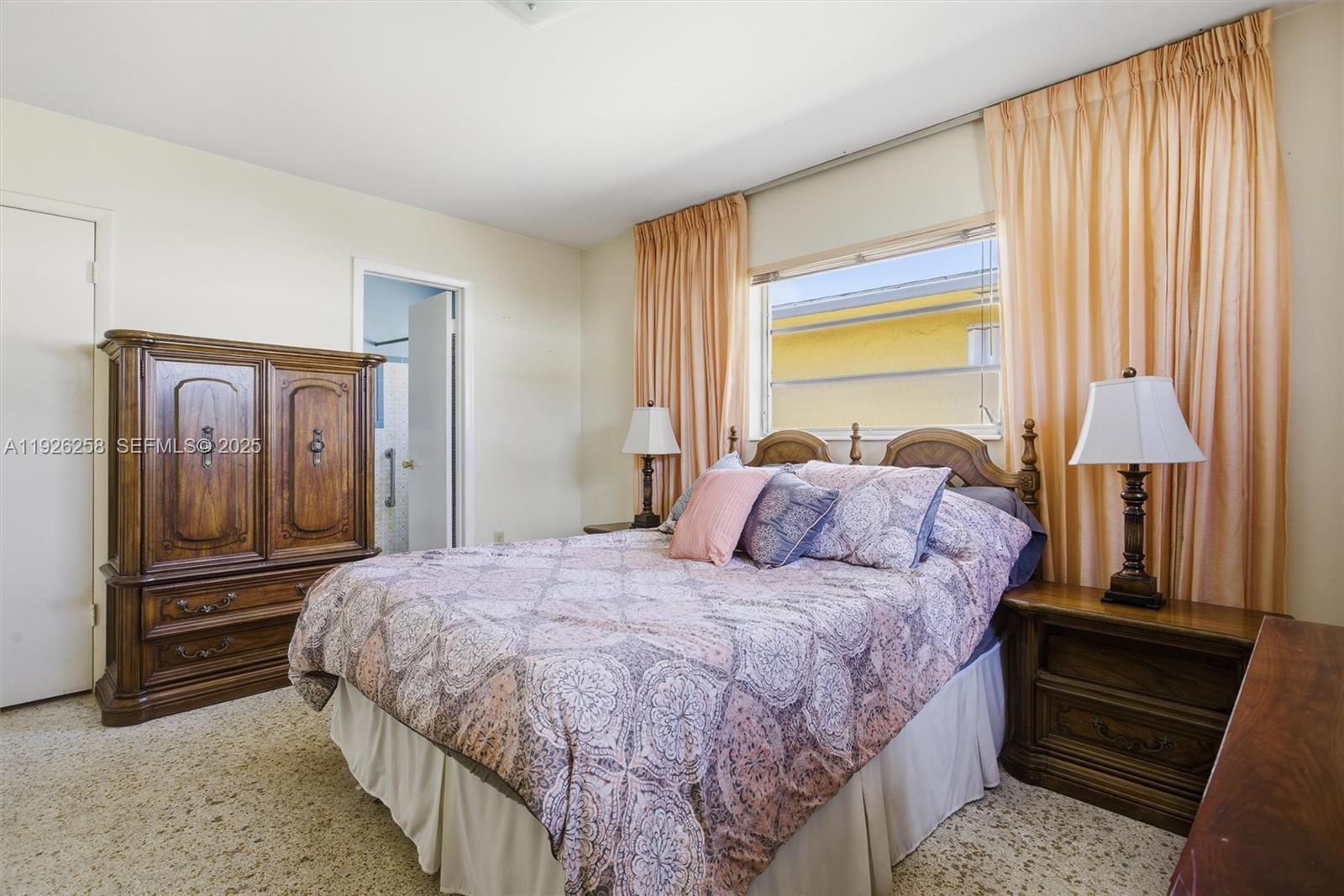 10551 Southwest 27th Street Miami, FL 33165 - Photo 17 of 35 a bedroom with a bed and a dresser