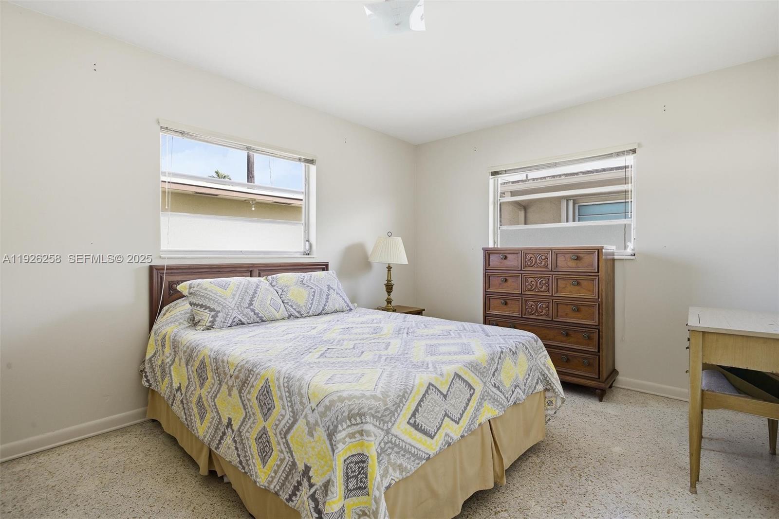 10551 Southwest 27th Street Miami, FL 33165 - Photo 20 of 35 a bedroom with a bed and a fireplace