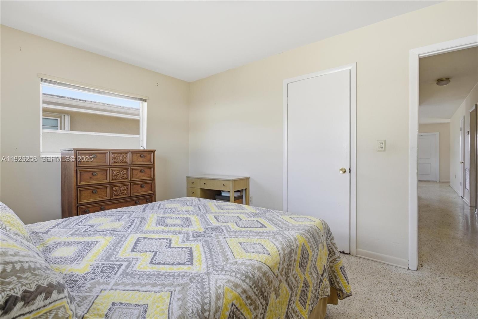 10551 Southwest 27th Street Miami, FL 33165 - Photo 21 of 35 a bedroom with a bed and a dresser