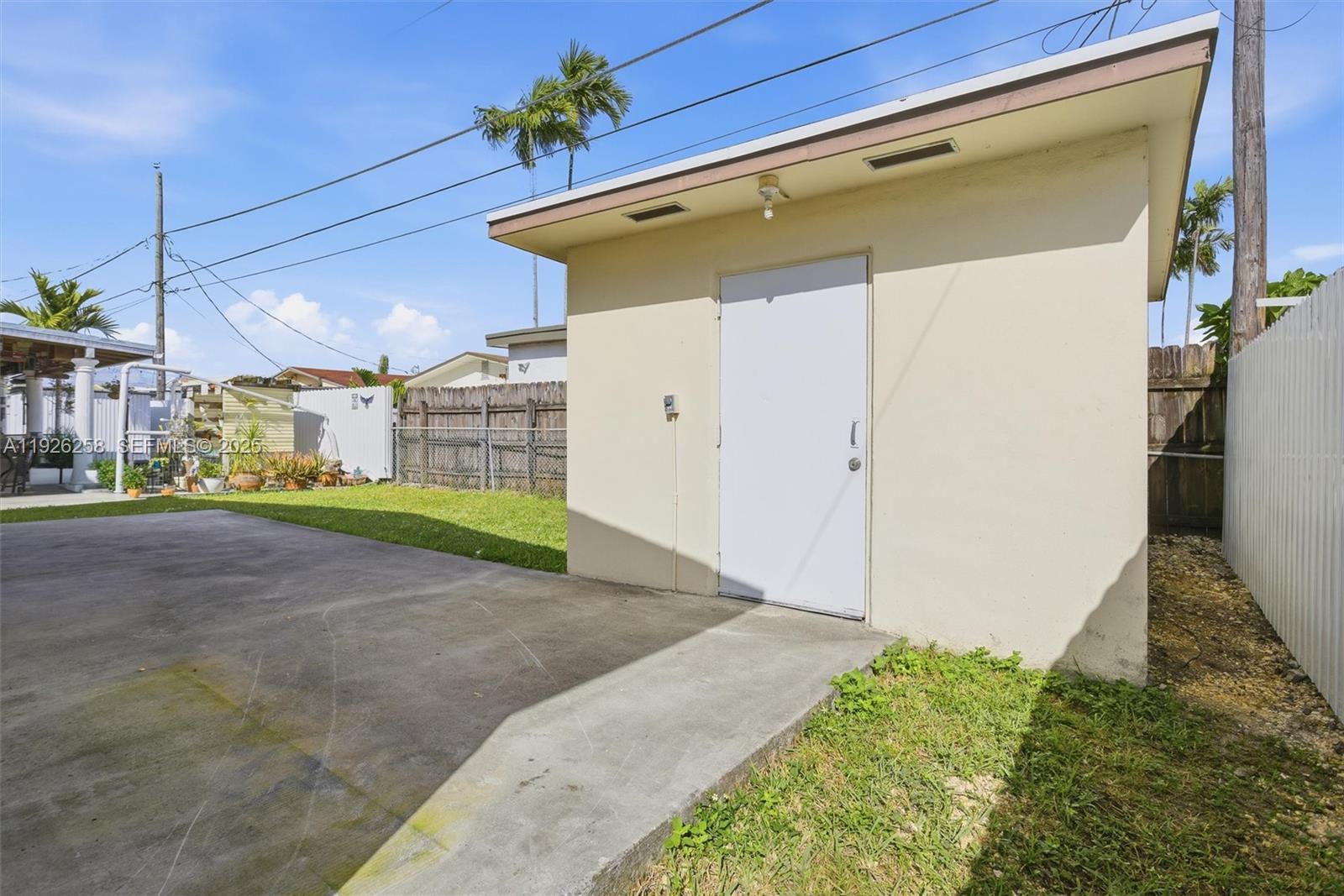 10551 Southwest 27th Street Miami, FL 33165 - Photo 9 of 35 a view of a back yard of the house