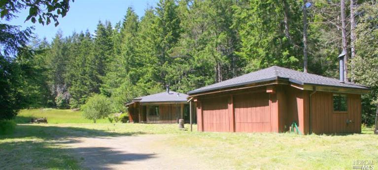 36688 Timber Ridge Road, Unit 30A The Sea Ranch, CA 95497 - Photo 1 of 1 a front view of a house with a yard